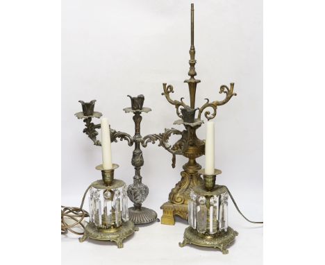 A pair of brass lustre drop candlesticks, lamp base and three branch candelabra, 59cm high
