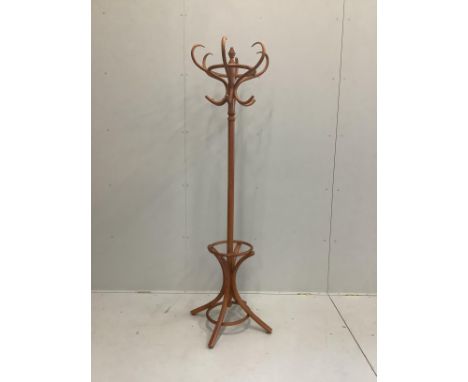 A turned beech combined hat and stick stand