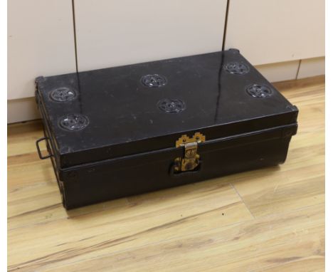A black lacquered tin trunk, 68cm wide