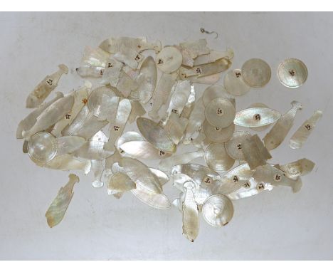A collection of Chinese mother of pearl gaming counters