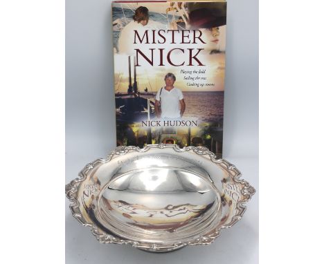 An Elizabeth II silver footed dish, with shaped scrolled border with shell detail, later engraved to side "Nick Hudson 13th J