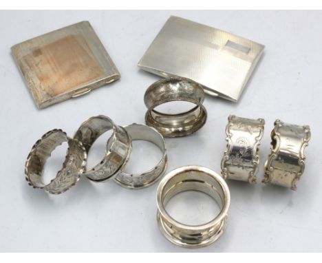 A small collection of silver to include: a George V silver cigarette case, with Art Deco engine turned design and vacant cart