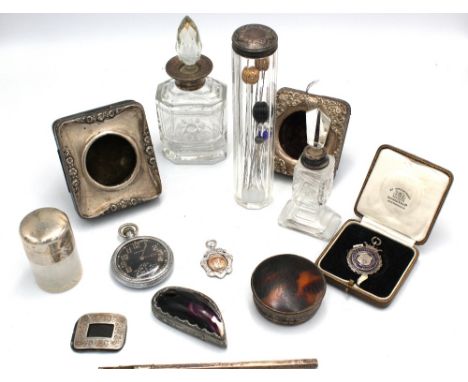 A small collection of silver to include: two easel back silver mounted pocket watch stands, one with engraved cartouche and f