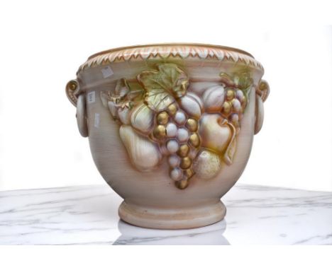 A 20th Century decorative planter with fruit detail, chip to handle