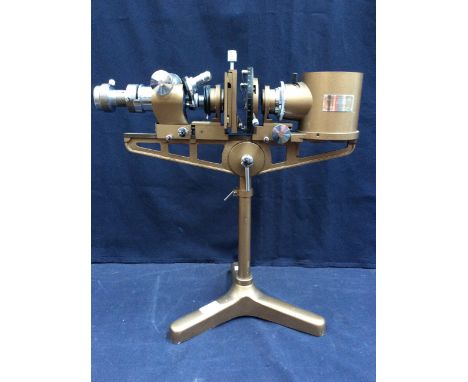  A mid 20th century Flatters and Garnett LTD of Manchester Precision Micro-Projector accessories; No. 2521; raised on three s