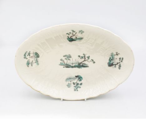 A small continental oval platter moulded sides, with 4 cartouches decorated with aqua green-coloured country scenes. Date: la