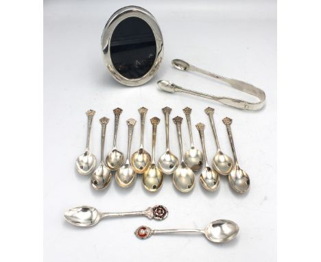 A collection of mixed silver to include: a matched set of twelve golfing interest Elizabeth II silver spoons, with rose termi