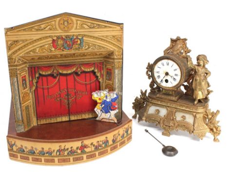 An early 20th Century child's theatre with different stage sets along with a 19th Century French spelter clock.
