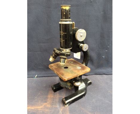 An early to mid 20th Century Cooke, Thoughton &amp; Simms Ltd, London &amp; York black and chrome microscope.