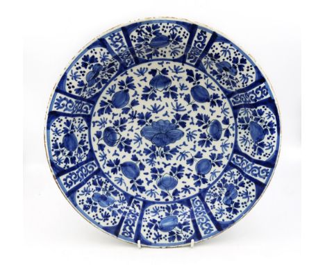 A Delftware blue and white charger, decorated with fruit and flowers. Date: late 18th century. Size: Diameter 34cm. Condition