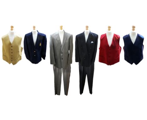  A collection of men's suits and waistcoats to include a 1980s camel cashmere waistcoat by Harvey Parker, a red wool waistcoa