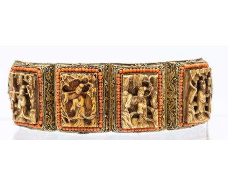 An early 20th century Chinese export silver gilt coral set bone panel bracelet, comprising four carved plaques in high relief