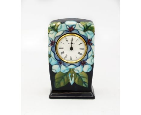 A Moorcroft Clock in the Tudor Rose design by Sally Tuffin, factory second, in good condition , Usual factory marks to base, 