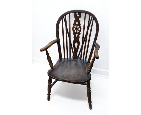 A 19th Century saddle sea bar/saloon stool along with a Windsor back kitchen armchair.
