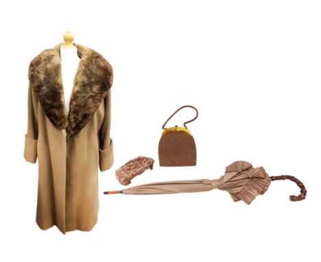 A mid 1950s camel coloured coat with faux fur collar, a half hat in camel colour which has a woven floral design with a tulle