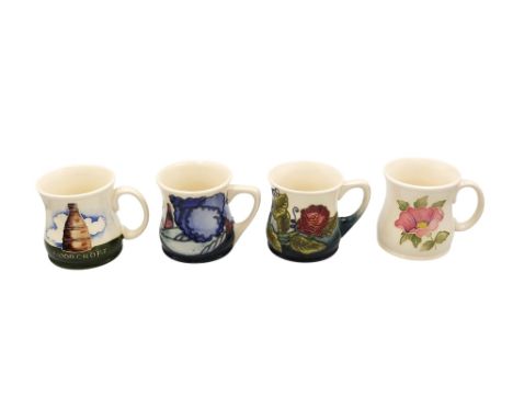 A group of 4 Moorcroft mugs to include 2 mugs made for the Moorcroft Collectors club (1997 &amp; 2000) together with a Walter
