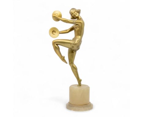 A 20th century Art Deco style gilt spelter figure of a partial nude female with cymbals, with medallion mark "Fabrication Fra