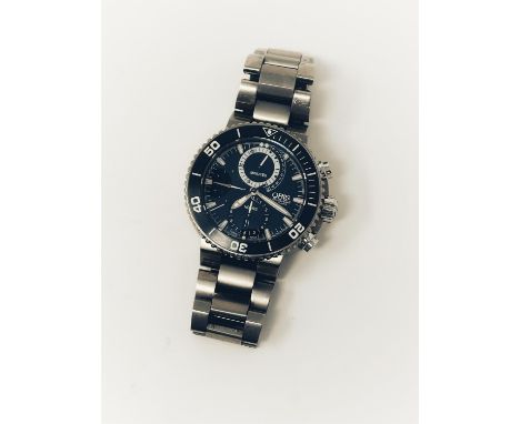 Professional divers chronograph made in titanium with helium release valve and solid titanium bracelet. The dial is black wit
