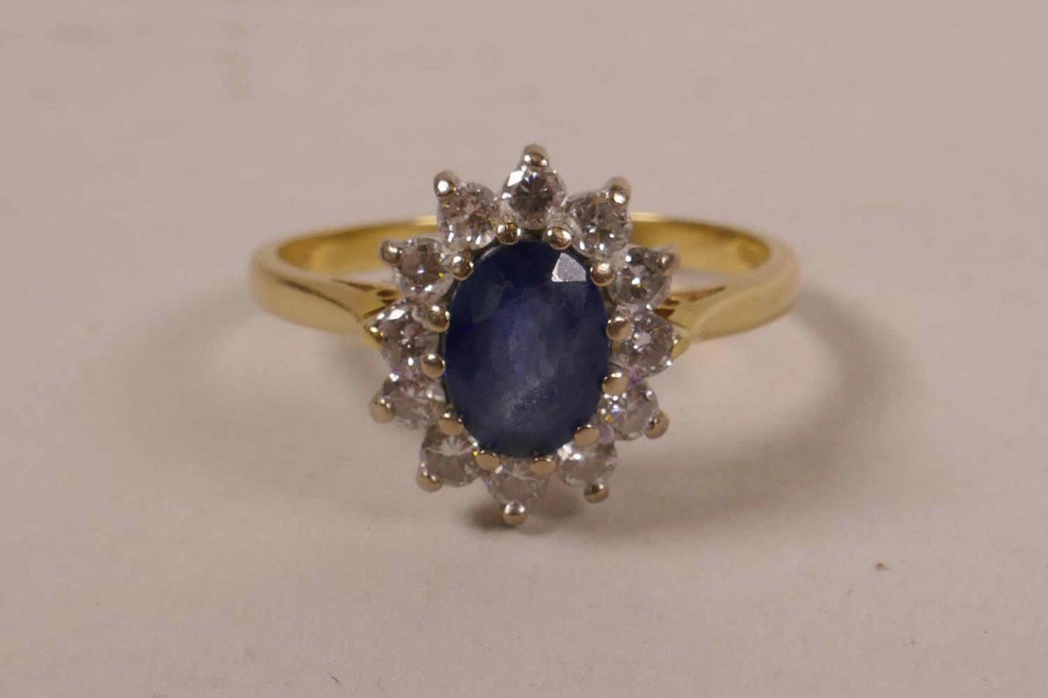 An 18ct gold, diamond and sapphire set Princess Diana ring, approximate ...