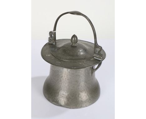 Art Nouveau pewter biscuit barrel, by Connell, having stylised swing handle above a lift up lid, with spot hammered tapering 
