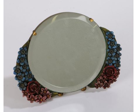 Barbola easel mirror, of circular form, with painted flowers either side in blue and red, with bevelled glass plate, 20cm wid
