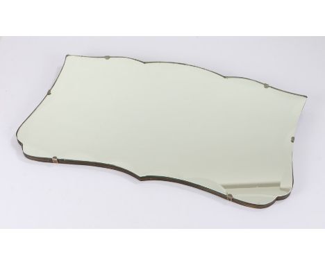 Mid 20th Century unframed wall mirror, of shaped form and with bevel glass, 53cm wide