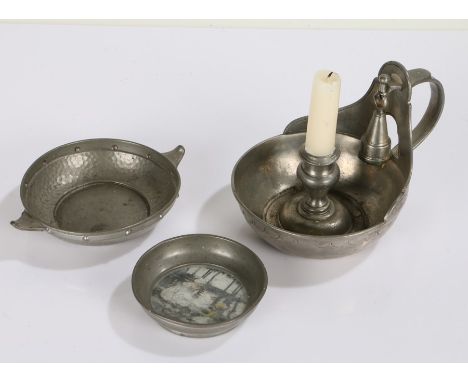 Arts and Crafts style pewter quench, with spot hammered body and dot decoration, together with a pewter chamberstick and snuf