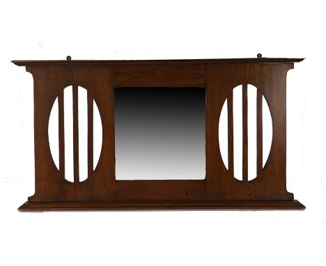 Arts and Crafts oak over mantel mirror, the moulded top above a square glass mirror, flanked by oval slatted motif either sid
