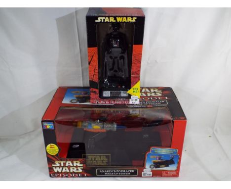 Star Wars - Two boxed Star Wars toys comprising Anakin's Pod Racer wake up system and Darth Vader talking alarm clock. Both a