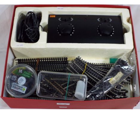 Model Railways - a box containing a quantity of Hornby OO gauge track including a HM2000 twin controller and a small quantity