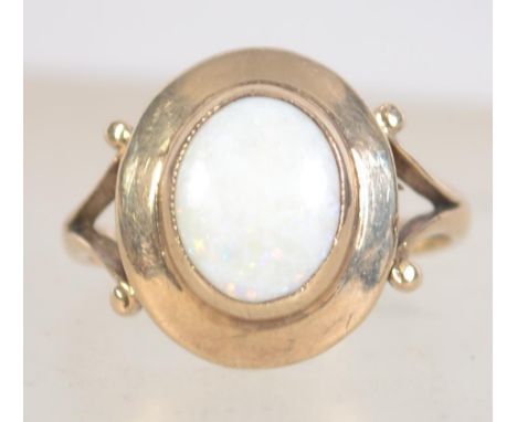 A hallmarked 9ct gold and opal ring. Hallmarked for London 1977. Size O.5.