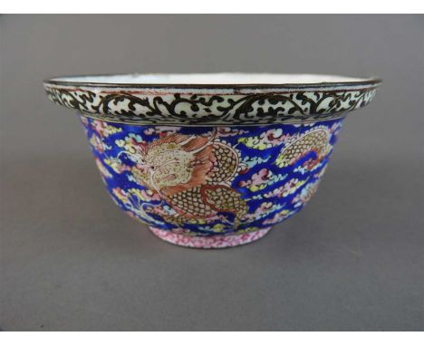 A Canton enamel dragon bowl, Qing Dynasty, with dished everted rim, the interior with two peaches on a branch, the exterior d
