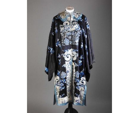 A selection of Chinese silk textiles, Qing and 20th century to include: a black silk blue lined robe embroidered with flowers