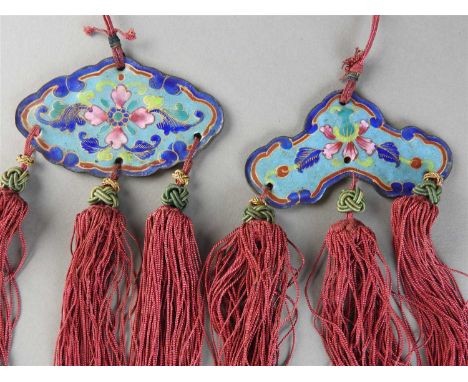 Two Chinese Canton famille rose enamel tasselled pendants, Qing dynasty 19th century, of wind chime shape and lozenge shape r