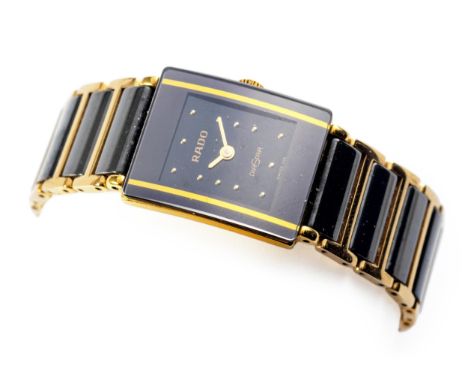 Reference 153.0283.3N, quartz, the rectangular black dial with gilt dot hour markers, on a gilt-metal and black ceramic link 
