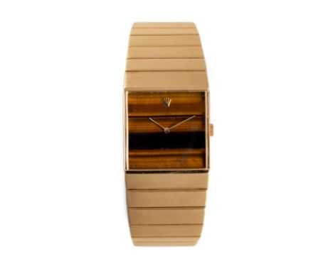 Numbered 3905, manual, square tiger's eye dial, on a tapered bracelet with brushed finish and folding clasp, width of case 24