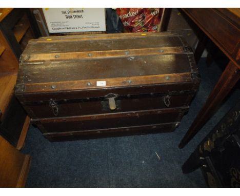 A BANDED DOMED TRAVELLING TRUNK