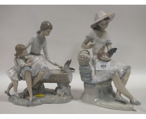 TWO NAO SEATED LADY FIGURES WITH BIRDS 