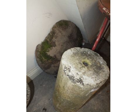 A LARGE STONE MUSHROOM TOP ON ROLLER BASE