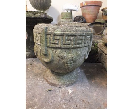 A CIRCULAR STONE PLANTER