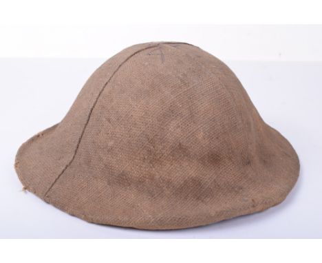 Rare Early 1st Pattern British Steel Combat Helmet of the North Staffordshire Regiment with its Original Trench Cover, being 