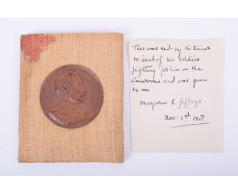 Gift Given by the Kaiser to German Troops in Cameroon, hessian pocket container with circular plaque to the centre having pro