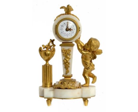 A FRENCH ORMOLU AND MARBLE TIMEPIECE, C1900 in the form of Putto standing beside a clock on a pedestal, 24cm h ++The movement