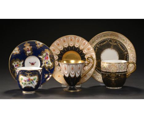THREE ROYAL WORCESTER COFFEE CUPS AND SAUCERS, 1920, 1925 AND 1929  one in 18th c Worcester style with cobalt ground and pain