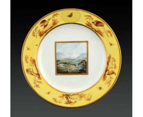 A DERBY PLATE, C1797-1800 painted probably by John Brewer with a landscape, the yellow border painted in sepia monochrome and