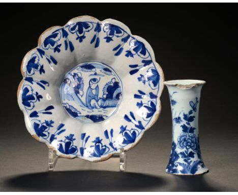 AN ENGLISH DELFTWARE WAISTED VASE, C1750-60  painted with a peony and fence pattern, 12cm h and a Dutch Delftware chinoiserie