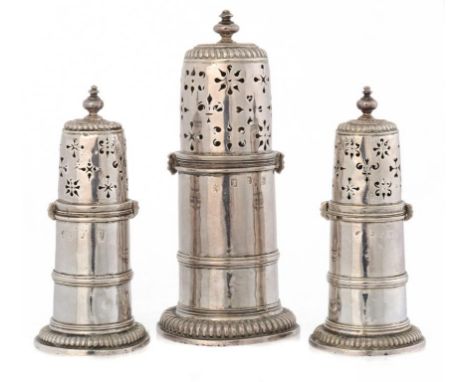 A WILLIAM III SILVER CASTER AND A PAIR OF QUEEN ANNE SILVER CASTERS  fully marked, both London, the first by Thomas Jenkins, 