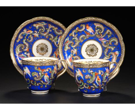 A PAIR OF COALPORT AZURE BLUE GROUND COFFEE CUPS AND SAUCERS, C1850 painted with birds and scrolls, saucer 14.5 diam, PODR ma