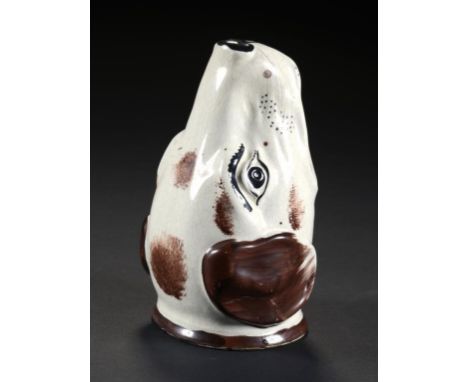 A STAFFORDSHIRE EARTHENWARE HOUND'S HEAD STIRRUP CUP, C1830 sponged in brown enamel and picked out in black, 12cm h ++In good