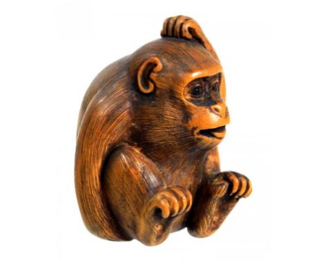 A JAPANESE WOOD NETSUKE OF A MONKEY SCRATCHING ITS HEAD, SIGNED BUNRAKU (BUNGAKU)  MEIJI PERIOD, LATE 19TH/EARLY 20TH C 4.1cm
